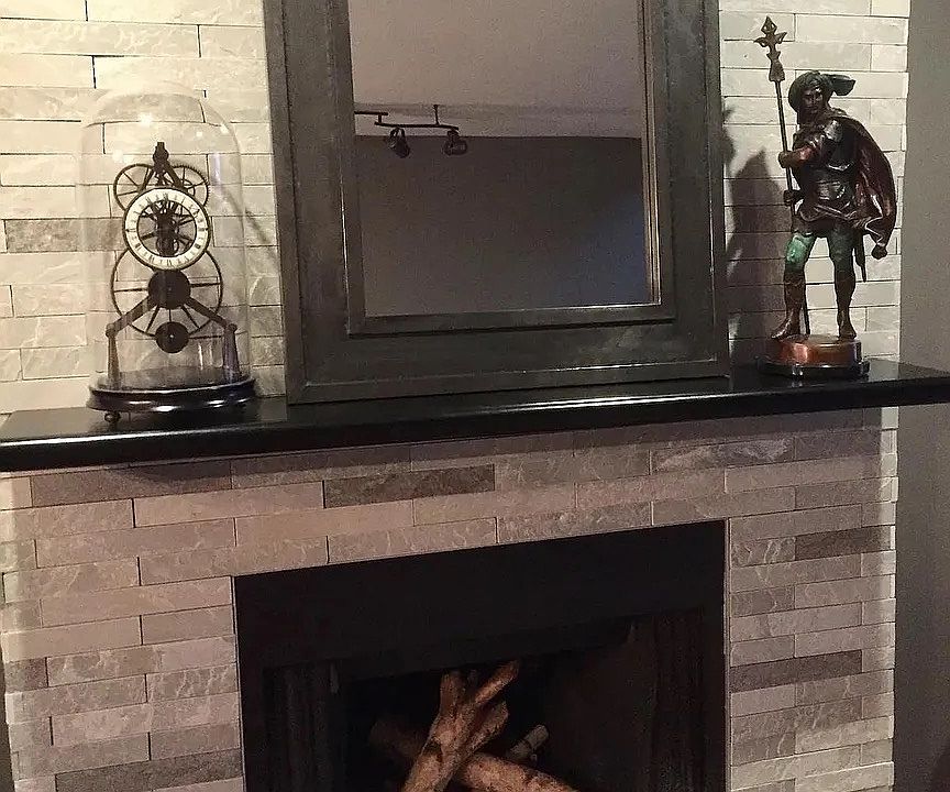 Fireplace in living room space.