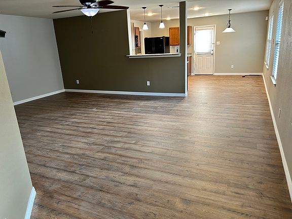 New luxury plank flooring in Kitchen pantry, and living room!