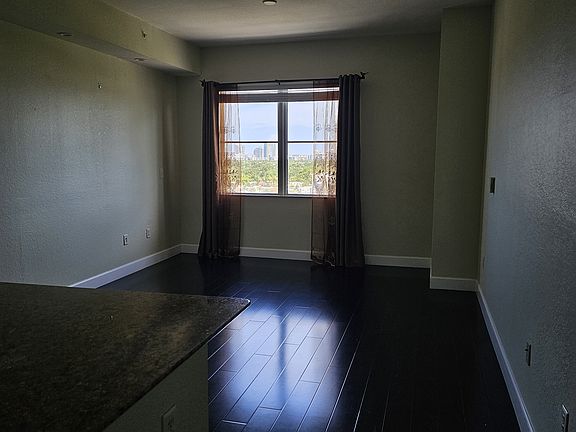 Living/dining room from front door (lights off).