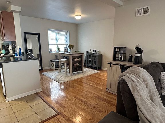 Spacious & Open w/ gorgeous hardwood floors throughout and ample natural lighting through large windows.