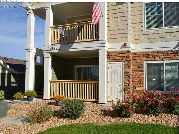 Exterior stone, accents with white trim.