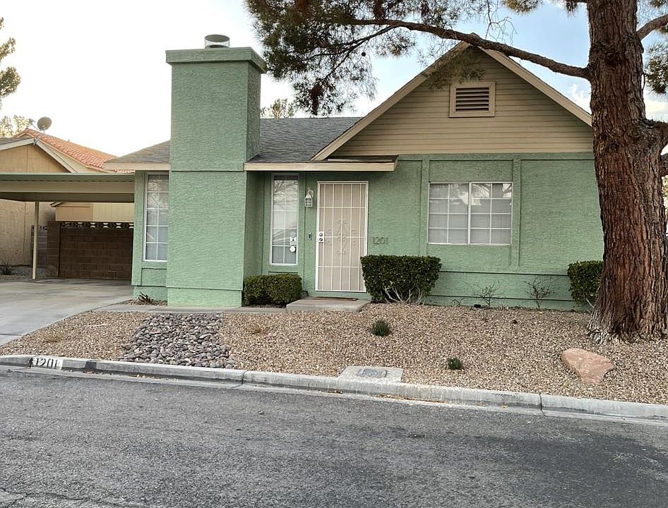 Front yard, two car covered carport.