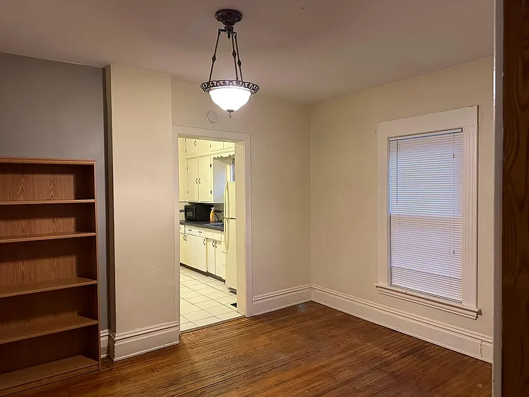 Dining Room with view into Kitchen with full wall shelving