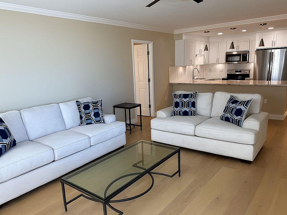 Main room with updated kitchen open to living area