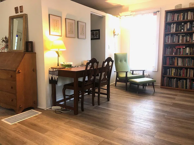 Main level, doorway leads to walk-in closet and bathroom with stall shower