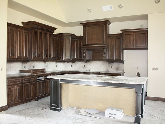 Kitchen opens to living