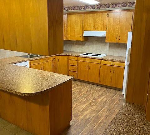 View from the peninsula eating area. Kitchen has cook top and oven (not visible) to the left.