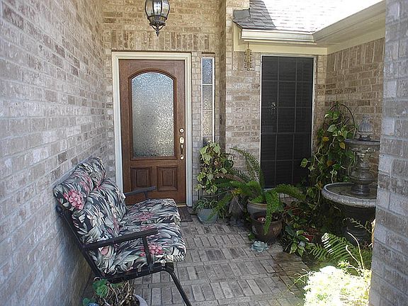 Bricked front porch...gutters also seen here.