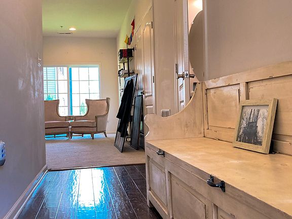 GROUND LEVEL 
 Front Hall from Foyer looking toward 300sq ft Office/Game Room
 Door Cracked to the Right is a Powder Room