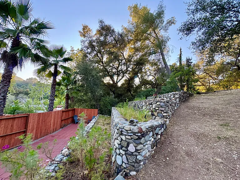 New pavers on lower garden patio. Stone planters have amazing earthworm rich soil, no clay. The planters face South, sun in the morning and filtered light in the afternoons. A gardener's dream.