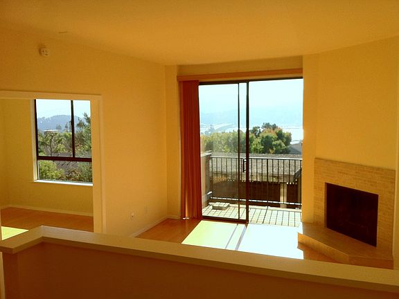 Living room with deck and view of SF
