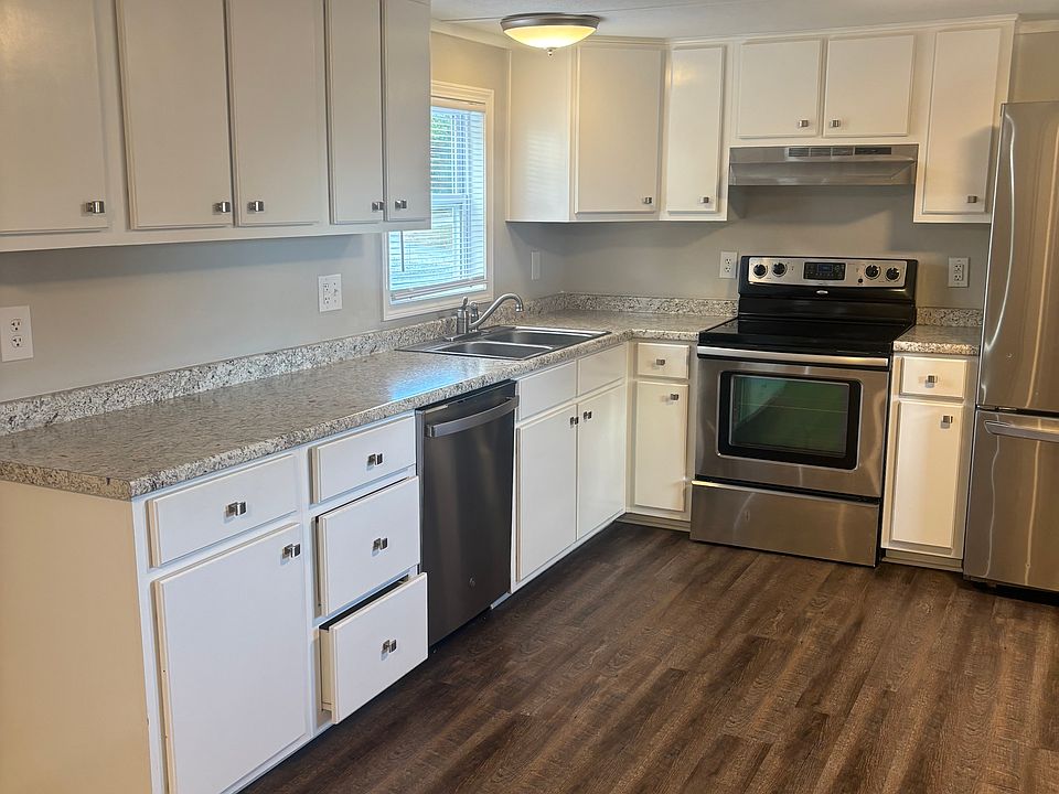 Kitchen with stainless steel appliances and solid wood cabinetry. Not Mobile home cabinetry.
