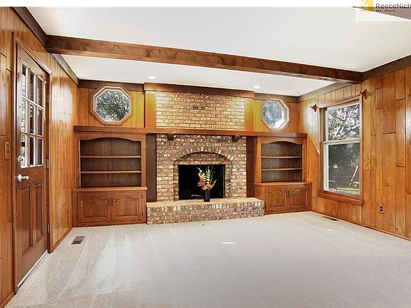 Fantastic Great Room has built-ins, gas start brick FP & beautiful woodwork!