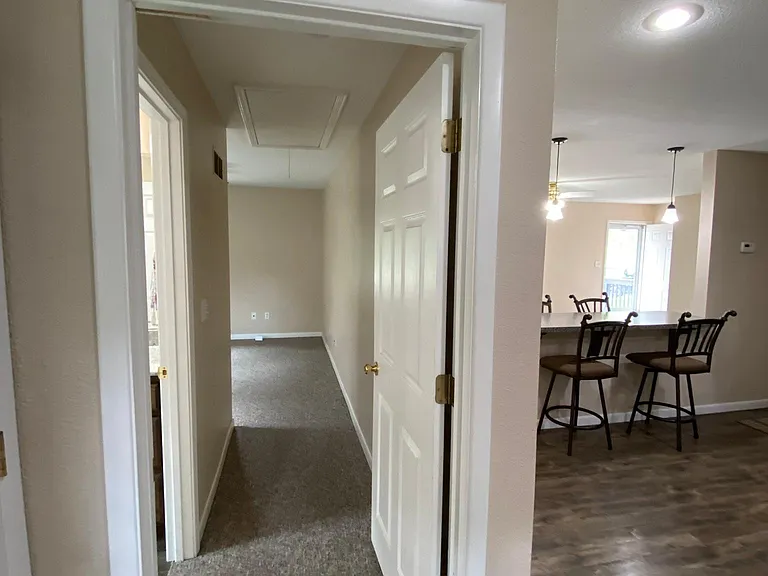 Laundry area view down hallway to Master Bath & Bedroom.