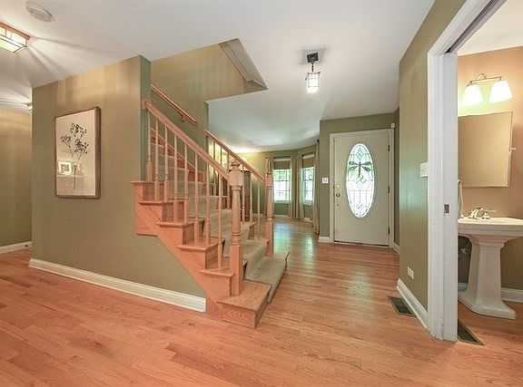 Foyer offers a warm welcome plus access to Living Room, half bath nearby and access to other rooms o