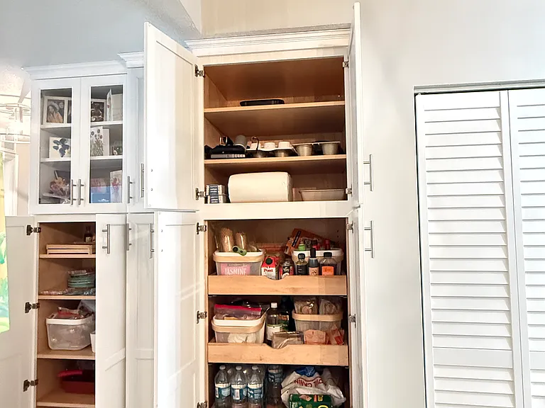 Plenty of extra storage custom cabinetry throughout