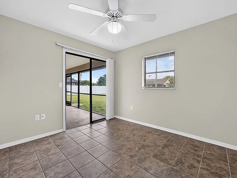 3rd bedroom with sliders opening to the lanai