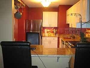Kitchen with granite breakfast bar, newer stainless applianc