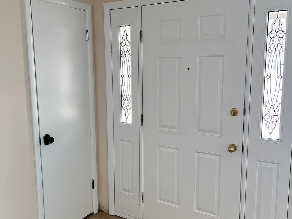 Front entry space into living room area with storage