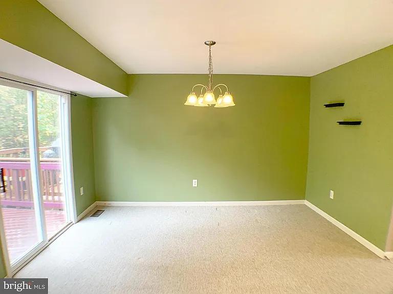 Main level: Family room/Daily dining room. Access to deck.
