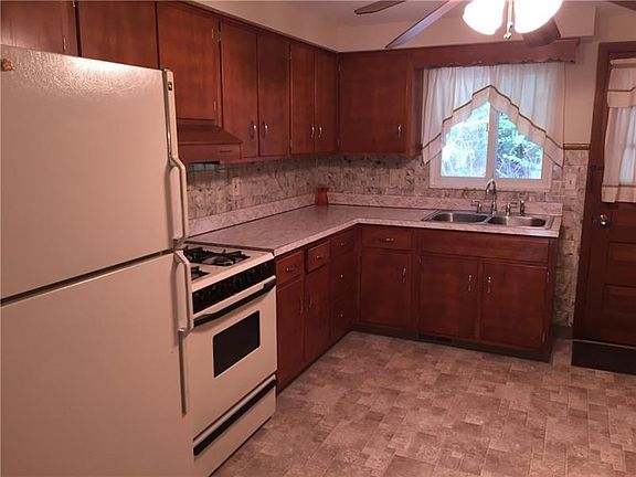 New Floor, New stainless double bowl sink and faucet with new shut off valves.  Nice space for a large table and chairs!