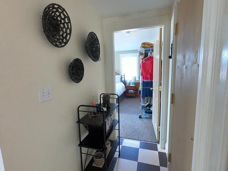 Hallway leading from kitchen to bedroom.