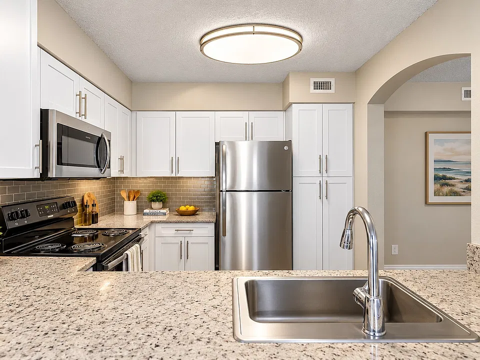 Elevate your lifestyle at Mosaic with this stunning kitchen designed for both functionality and style. Modern appliances, elegant finishes, and spacious countertops make it a perfect space for culinary creativity. Schedule your tour today!