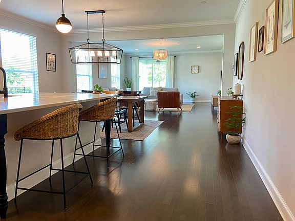 Open and light kitchen, dining and living room. Engineered hardwood flooring.