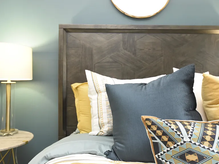 Experience tranquility in this beautifully designed bedroom with elegant decor.