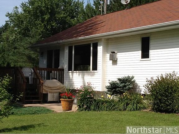 Deck over looking the backyard with lake views.