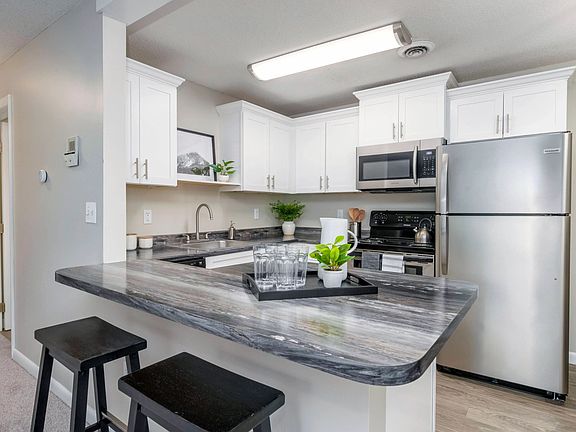 Enjoy the modern allure of our well-appointed kitchens featuring stainless steel appliances, spacious countertops, and ample cabinetry for your convenience.