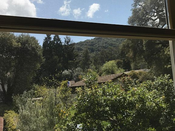 View from the bedroom window looking south toward the Santa Cruz mountains that border Los Gatos.