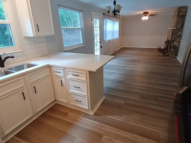 Coming into the open kitchen, eating area, and large family room.