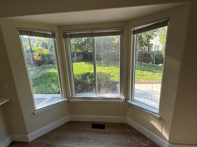 Bay window in dining area looking to the patio and backyard.