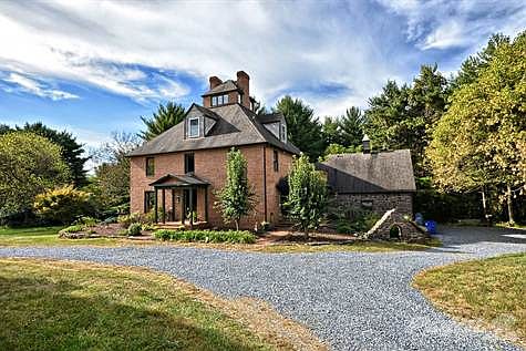Front view with circular driveway