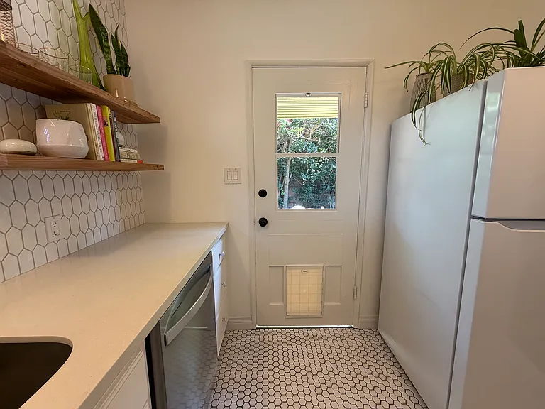 New flooring and backdoor with doggy door.