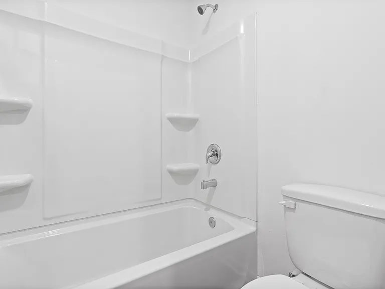 A shower/tub combination in the secondary bathroom.