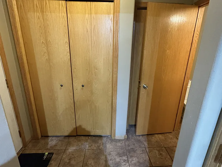 Entry foyer from garage entry, showing utilities room