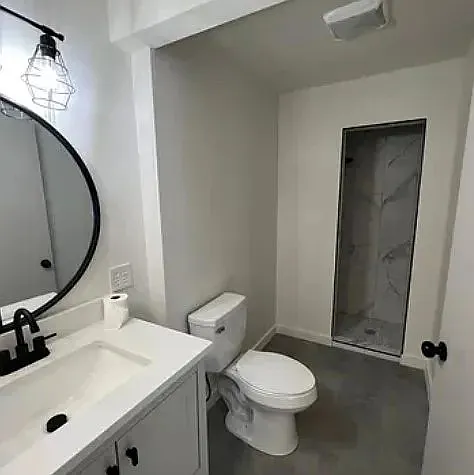 Beautifully updated primary bathroom with modern finishes, separate shower, and soaking tub