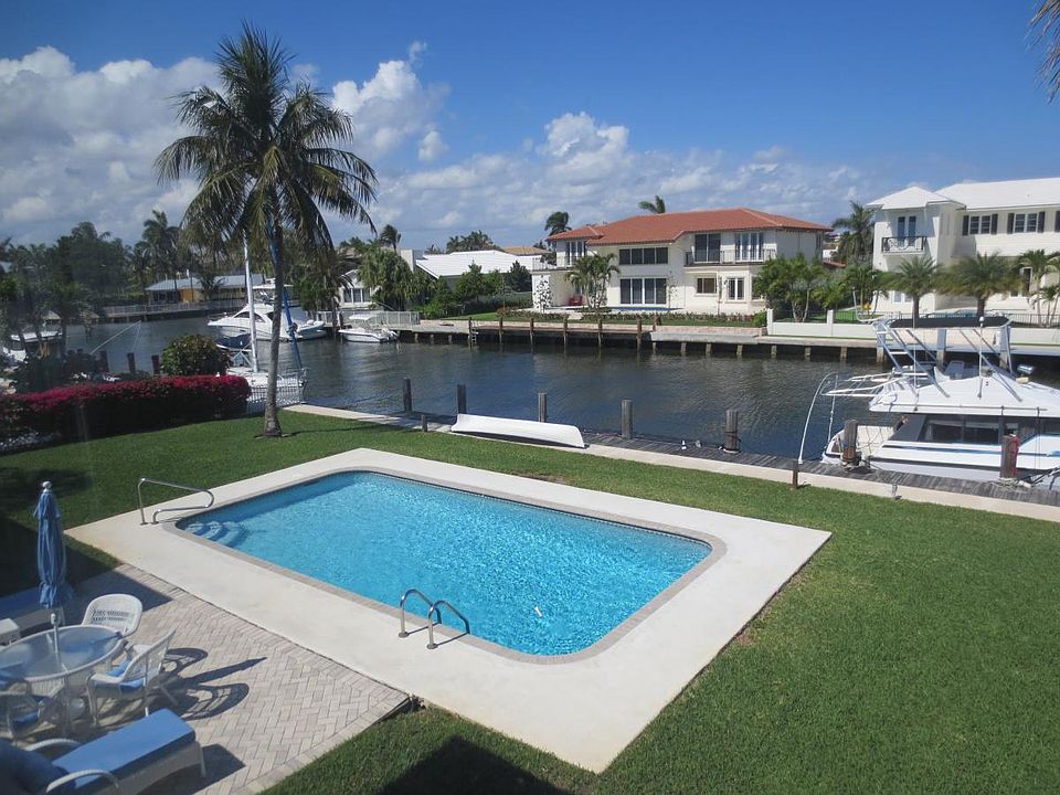 Pool, Canal, Dock, and Patio from Inside Condo