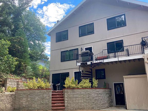 Entrance to studio is from the back yard up the stairs shown here to a raised private brick patio for your use only.