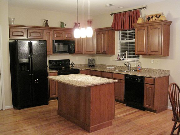 Granite Counter Tops, Blonde Hard Wood Flooring