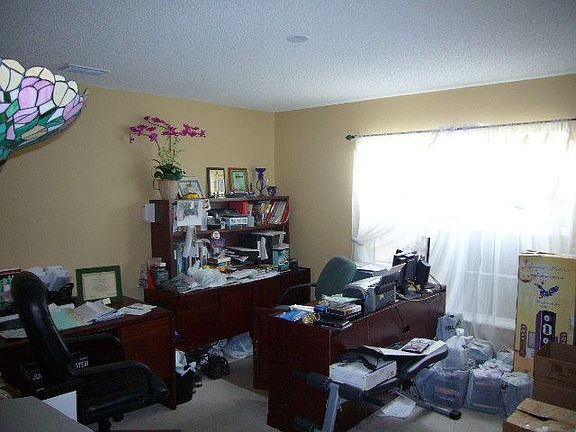 This room was built as a formal living room, but we're packing up, too!