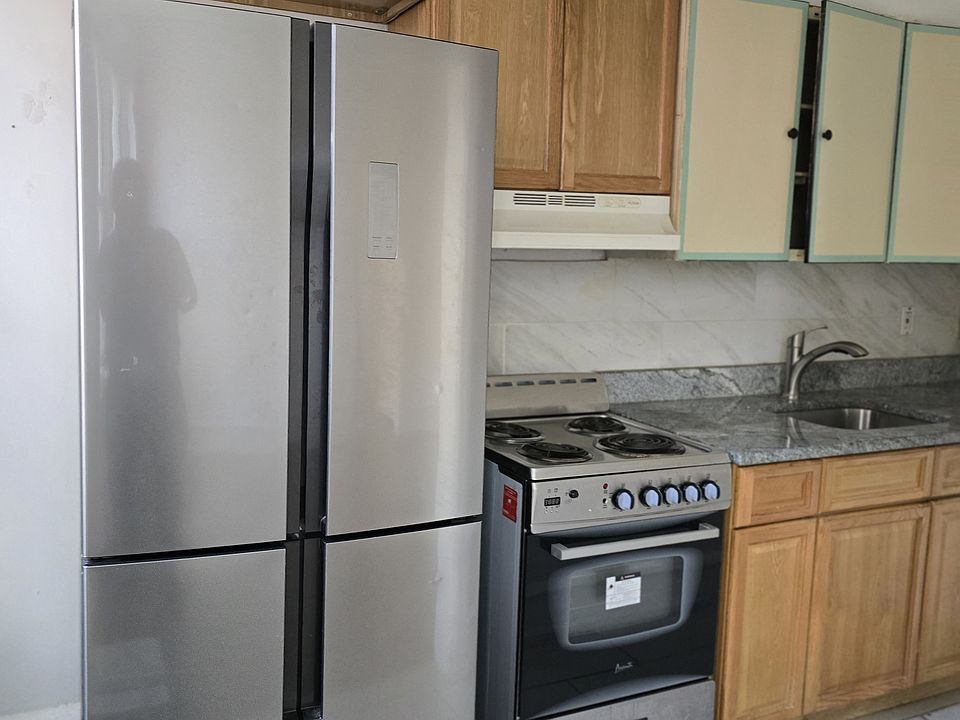 Kitchen with granite countertops with new styles of appliances