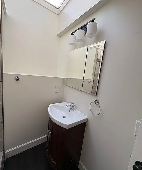Bathroom sink with vanity mirror storage
