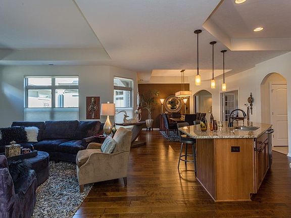 From the foyer you enter into the combination great room and kitchen.  Note that the ceilings are 10' height throughout the home and have interesting design features.  This transitional dcor will appeal to a variety of buyers whether they are contemporary