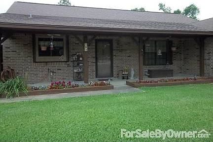 close up front view : front porch has motion sensor lighting fixtures and ceiling fans