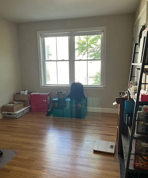 Bedroom #2. Comfortably fits a queen bed and dresser. Double door closet and double window.