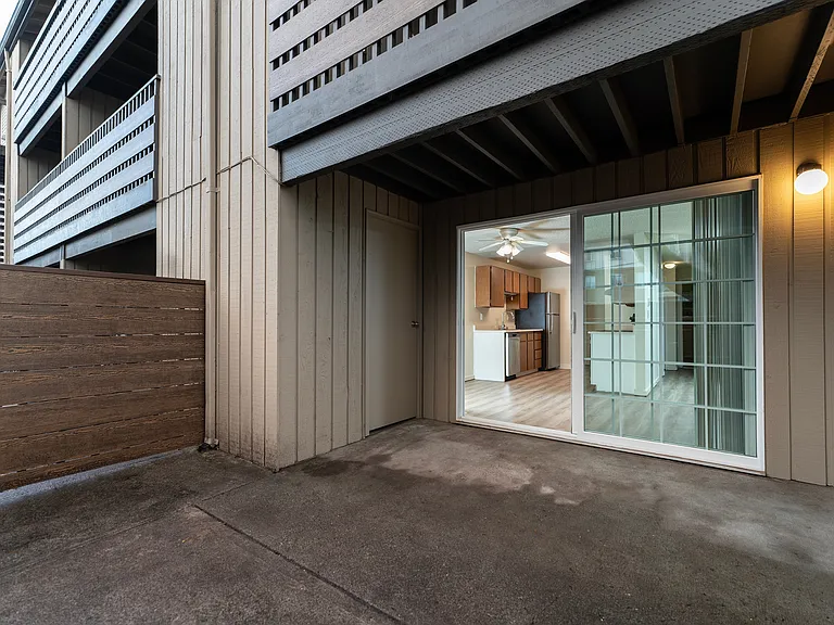 Step into comfort with this inviting patio entrance, featuring a seamless connection to a modern kitchen. Step into comfort with this inviting patio entrance, featuring a seamless connection to a modern kitchen.