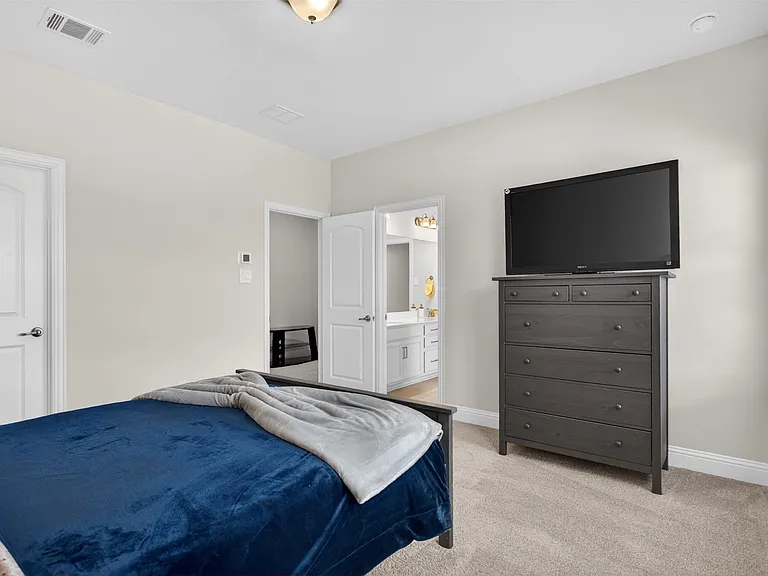 Neutral tone walls with carpet flooring